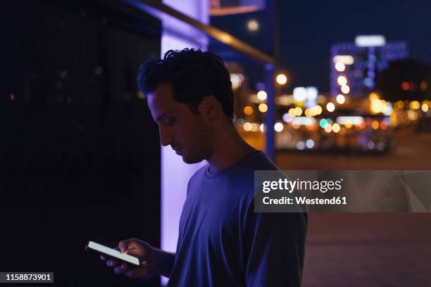 Man Using Cell Phone Light Face Light And Dark Side Photos and Premium High Res Pictures - Getty Images