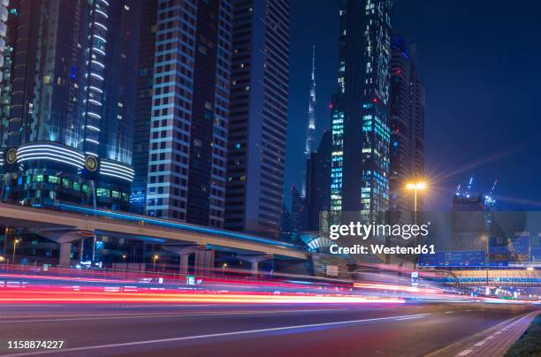 united arab emirates, dubai, sheikh zayed road at night - dubai road stock pictures, royalty-free photos & images