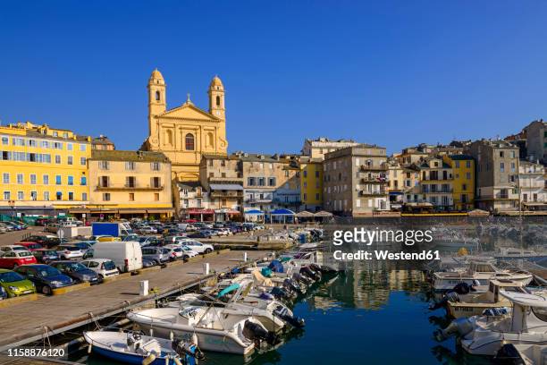 france, corsica, bastia, old harbour with st. john baptist church - bastia stockfoto's en -beelden
