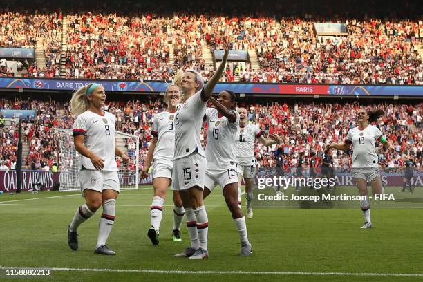 Megan Rapinoe of the USA celebrates with teammates after scoring her team's first goal during the 2019 FIFA Women's World Cup France Quarter Final...