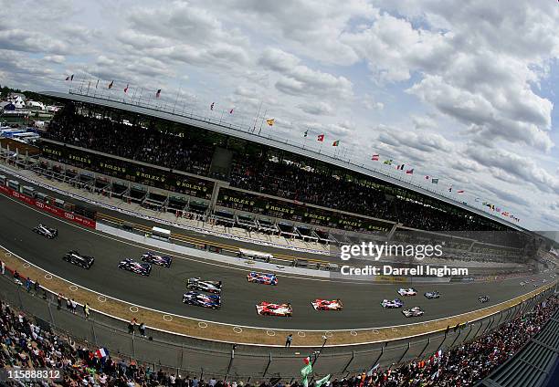 Benoist Treluyer of France driving the Audi Sport Team Joest Audi R18 TDI leads the field at the start of the 79th running of the Le Mans 24 hours...