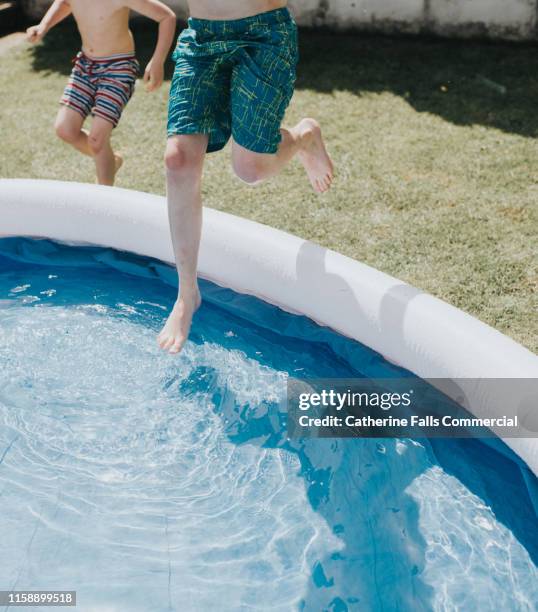 summertime paddling pool fun - oar stock pictures, royalty-free photos & images