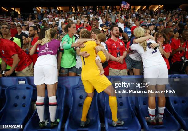 Players celebrate with their family following their victory in the 2019 FIFA Women's World Cup France Quarter Final match between France and USA at...