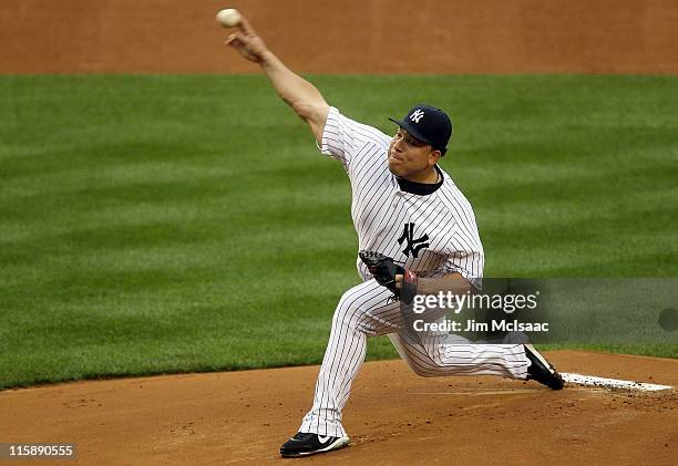 Bartolo Colon of the New York Yankees delivers a pitch against the Cleveland Indians on June 11, 2011 at Yankee Stadium in the Bronx borough of New...