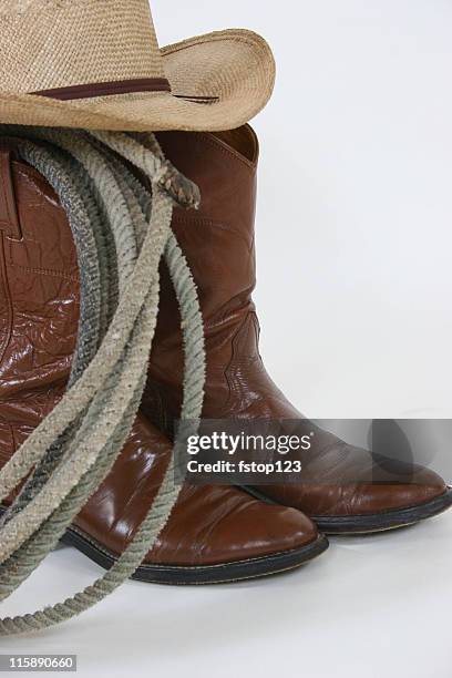 cowboy gear boots, hat and rope - cowboyhoed stockfoto's en -beelden