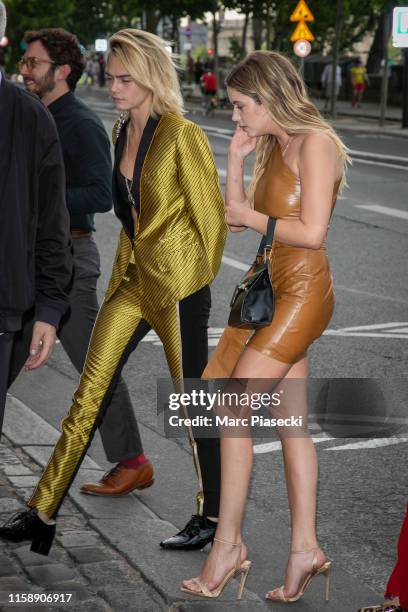 Cara Delevingne and Ashley Benson arrive at 'Laperouse' restaurant on June 28, 2019 in Paris, France.