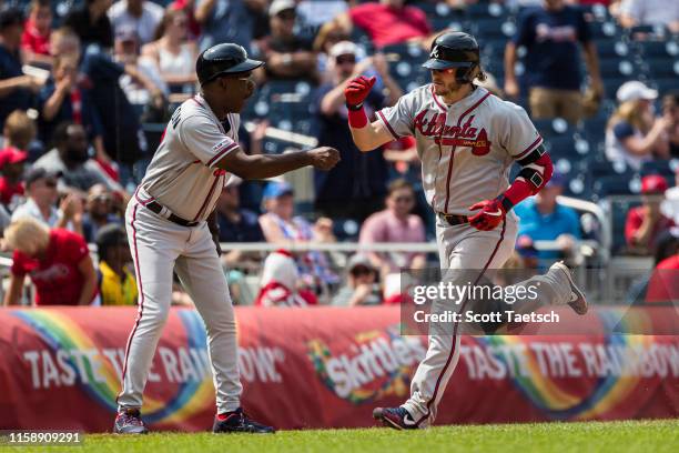 Josh Donaldson of the Atlanta Braves rounds the bases after hitting the game winning home run against the Washington Nationals during the tenth...