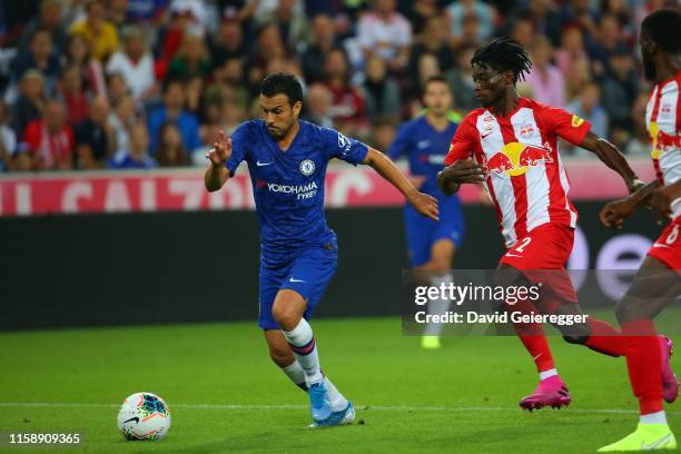 Pedro of Chelsea and Gideon Mensah of Salzburg during the friendly match between RB Salzburg and FC Chelsea at Red Bull Arena on July 31, 2019 in...