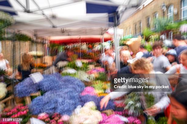 an impressionist view of the famous london street market columbia road - columbia road stock pictures, royalty-free photos & images