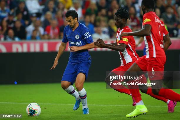 Pedro of Chelsea challenges Gideon Mensah of Salzburg during the friendly match between RB Salzburg and FC Chelsea at Red Bull Arena on July 31, 2019...