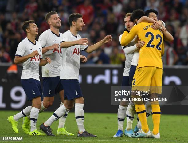 Tottenham Hotspur's Argentinian goalkeeper Paulo Gazzaniga and his teammates celebrate winning the penalty shoot-out of the Audi Cup final football...