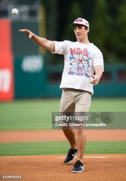 Actor Miles Teller throws the ceremonial first pitch at the San Francisco Giants vs Philadelphia Phillies game at Citizens Bank Park on July 31, 2019...