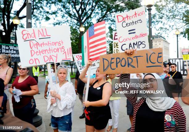 Pro-immigration protesters march in Grand Circus Park on July 31, 2019 in Detroit, Michigan, before the second round of the second Democratic primary...