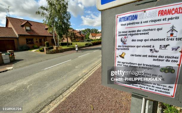 Signs that reads "Attention Village Francais" or "Attention French village" is posted at the entrance of the village of Inchy-en-artois, north...