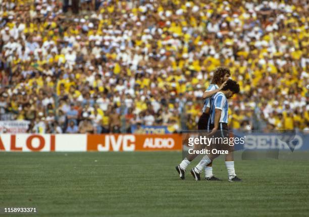 Diego Maradona and Alberto Tarantini of Argentina looks dejected during the World Cup match between Argentina and Brazil in Estadi de Saria at...