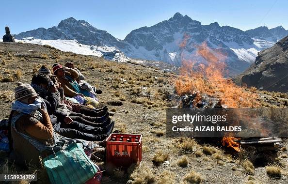 Andean Rituals Aymara indigenous perform an Andean ritual burning sullus to thank ...