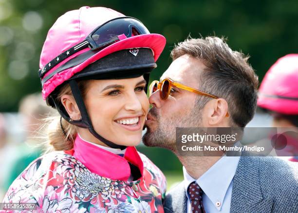 Spencer Matthews kisses wife Vogue Williams before she takes part in the 'Magnolia Cup' charity ladies race on 'Ladies Day' of the Qatar Goodwood...