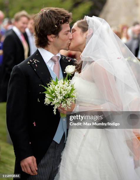 Sam Waley-Cohen and Annabel Ballin kiss after their wedding at St. Michael and All Angels church on June 11, 2011 in Lambourn, England.