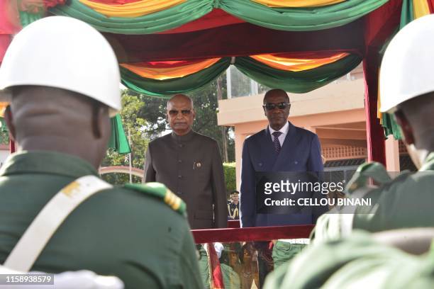 Indian president Ram Nath Kovind is welcomed by president Alpha Conde of Guinea at Conakry airport on August 1, 2019 as part of Indian president West...