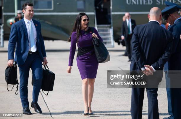 White House Press Secretary Stephanie Grisham walks to board Air Force One prior to departure with US President Donald Trump from Joint Base Andrews...