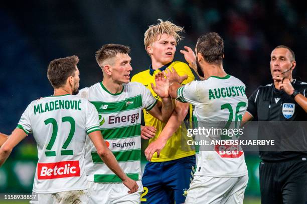 Lechia Gdansk's Filip Mladenovic , Michal Nalepa and Blazej Augustyn react with Broendby IF Tobias Boerkeeiet during the second leg of the Europa...
