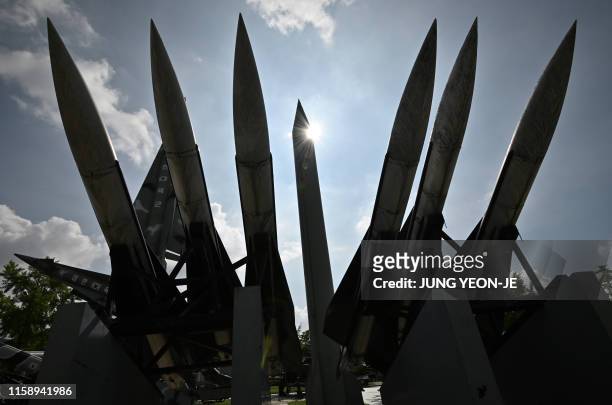Replica of a North Korean Scud-B missile and South Korean Hawk surface-to-air missiles are displayed at the Korean War Memorial in Seoul on August 2,...