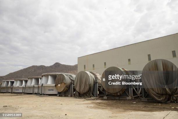 Turbine parts sit in storage at the site of the under-construction Grand Ethiopian Renaissance Dam in the Benishangul-Gumuz Region of Ethiopia, on...