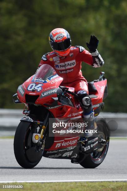 Mission Winnow Ducati's Italian rider Andrea Dovizioso waves to his fans after the first practice session of the Moto GP Grand Prix of the Czech...