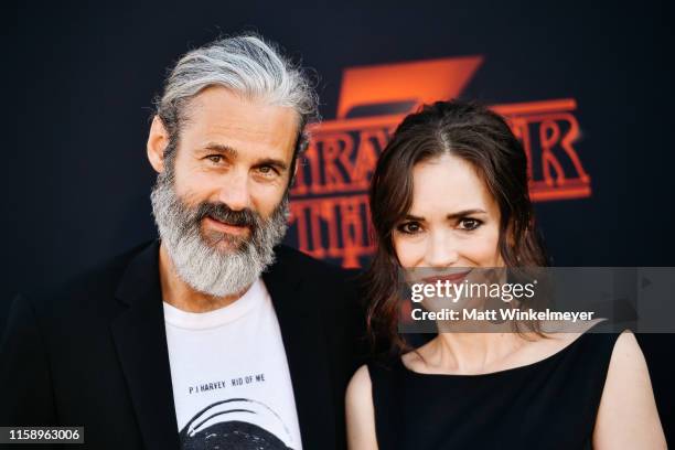 Scott Mackinlay Hahn and Winona Ryder attend the premiere of Netflix's "Stranger Things" Season 3 on June 28, 2019 in Santa Monica, California.