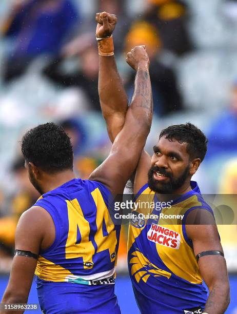 Liam Ryan of the Eagles is congratulated by Willie Rioli after kicking a goal during the round 15 AFL match between the Hawthorn Hawks and the West...