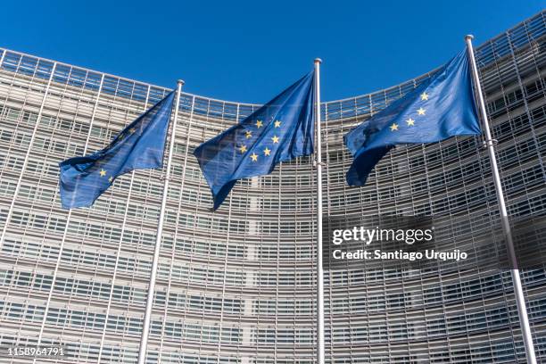 european union flags at berlaymont building of the european commission - berlaymont 個照片及圖片檔