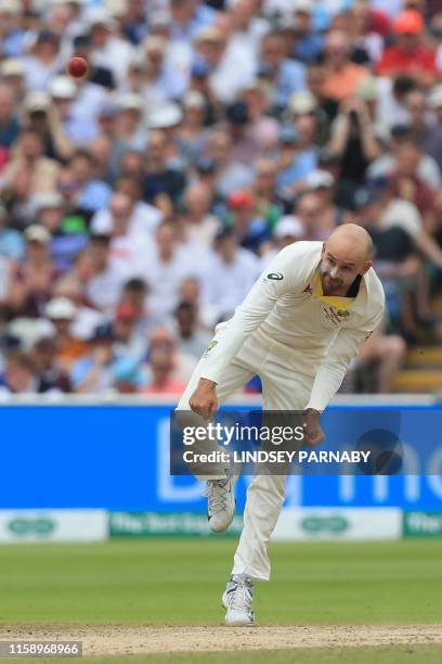 Australia's Nathan Lyon bowls during play on the second day of the first Ashes cricket Test match between England and Australia at Edgbaston in...