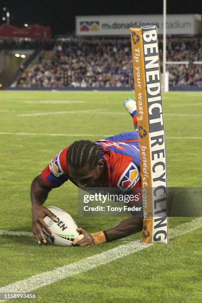 Edrick Lee of the Newcastle Knights scores a try during the round 15 NRL match between the Newcastle Knights and the Brisbane Broncos at McDonald...