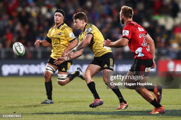 Beauden Barrett of the Hurricanes passes during the Super Rugby Semi Final between the Crusaders and the Hurricanes at Orangetheory Stadium on June...