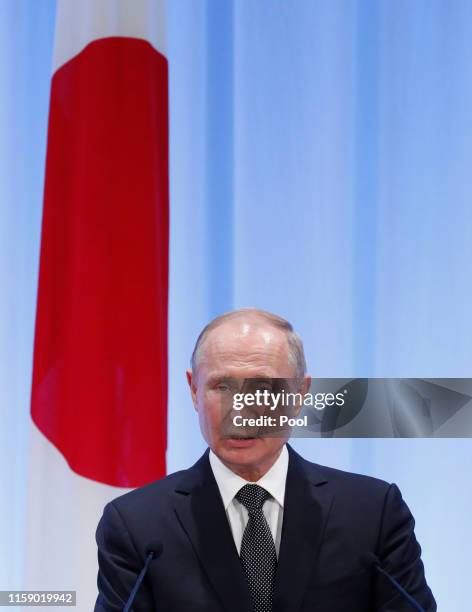 Russian President Vladimir Putin speaks at a news conference with Japanese Prime Minister Shinzo Abe at G20 leaders summit on June 29, 2019 in Osaka,...