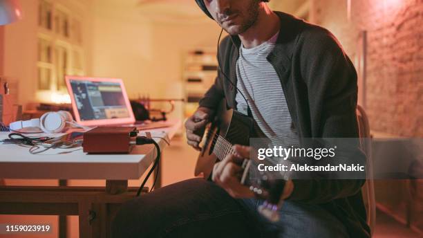 musician in home music studio - musician studio stock pictures, royalty-free photos & images