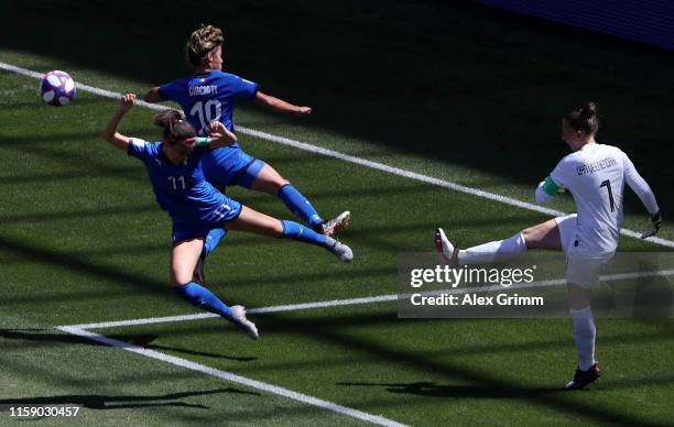 Sari Van Weenendaal of the Netherlands is closed down by Valentina Giacinti and Barbara Bonansea of Italy during the 2019 FIFA Women's World Cup...