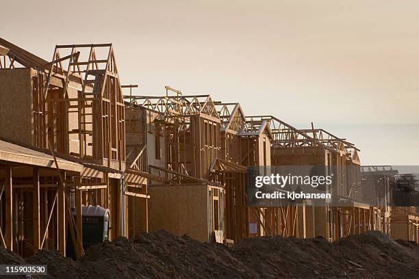 houses under construction - new home construction frame stock pictures, royalty-free photos & images