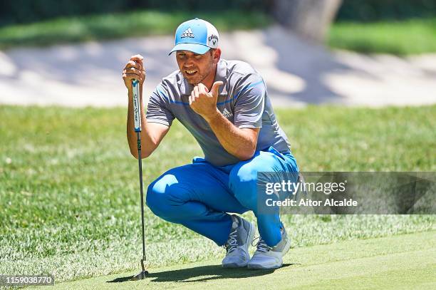 Sergio Garcia lines up a putt on the 1st green during Day Three of the Estrella Damm N.A. Andalucia Masters hosted by the Sergio Garcia Foundation at...