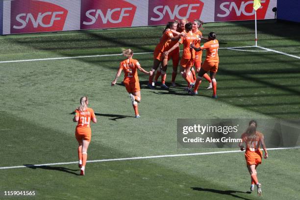 Vivianne Miedema of the Netherlands celebrates with teammates after scoring her team's first goal during the 2019 FIFA Women's World Cup France...