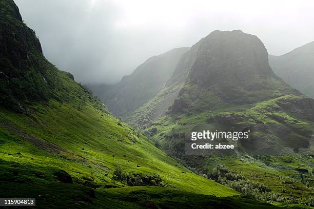 glencoe pass on a misty day - scotland stock pictures, royalty-free photos & images