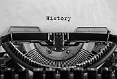 History typed on an vintage typewriter, old paper.