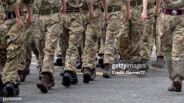 military personnel parading on union street, aberdeen during armed forces day, 2019 - war veteran stock pictures, royalty-free photos & images