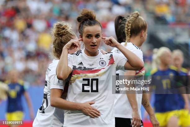 Lina Magull of Germany celebrates as she scores her team's first goal with team mates during the 2019 FIFA Women's World Cup France Quarter Final...