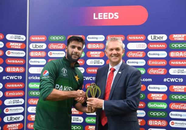 Pakistan batsman Imad Wasim receives his man of the match award after the Group Stage match of the ICC Cricket World Cup 2019 between Pakistan and...