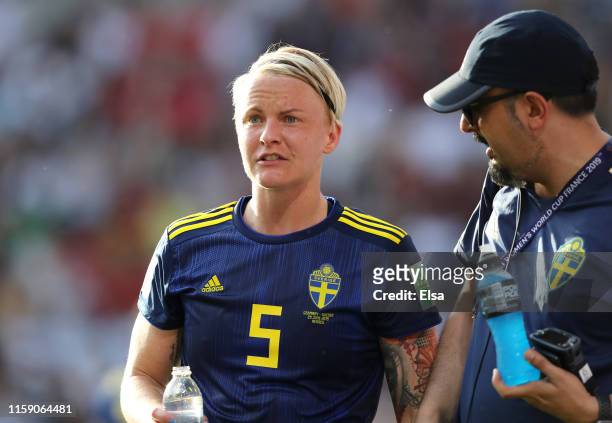Nilla Fischer of Sweden is given assistance during the 2019 FIFA Women's World Cup France Quarter Final match between Germany and Sweden at Roazhon...