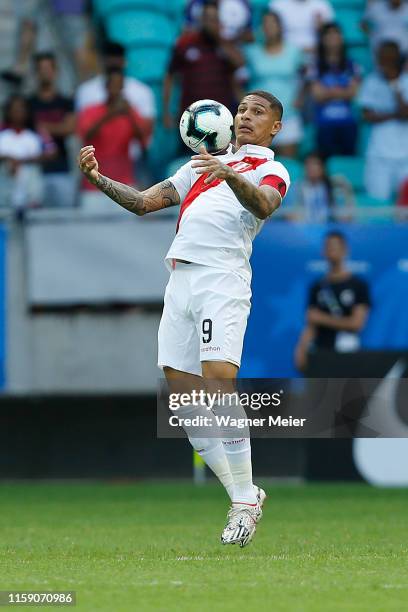 Paolo Guerrero of Peru chests the ball during the Copa America Brazil 2019 quarterfinal match between Uruguay and Peru at Arena Fonte Nova on June...