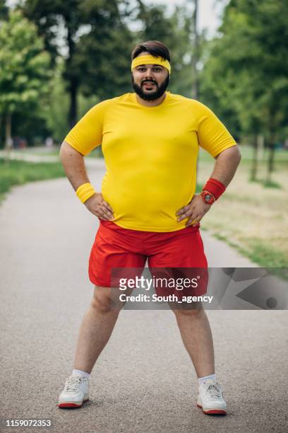 overweight man in sport clothing portrait - mens shorts stock pictures, royalty-free photos & images