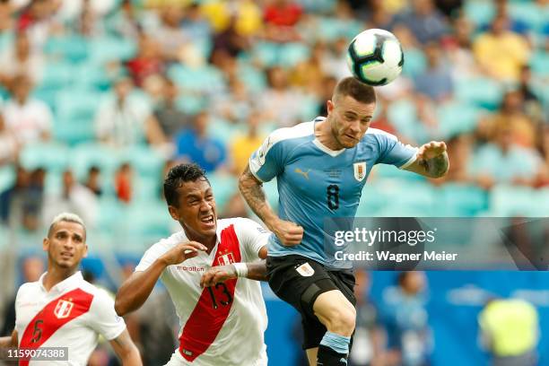 Nahitan Nandez of Uruguay heads the ball against Renato Tapia of Peru during the Copa America Brazil 2019 quarterfinal match between Uruguay and Peru...