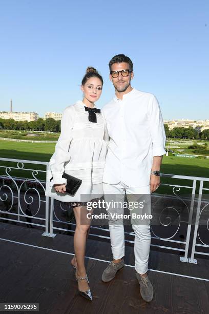 Olivia Palermo and Johannes Huebl attend Miu Miu Club event at Hippodrome d'Auteuil on June 29, 2019 in Paris, France.